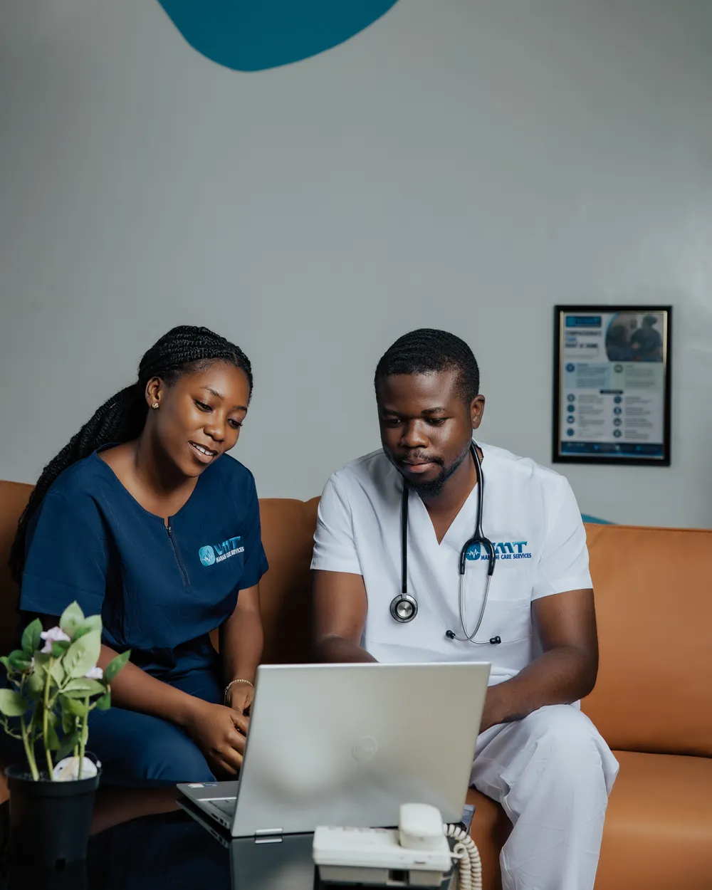 VMT clinician and care coordinator reviewing a case on a laptop