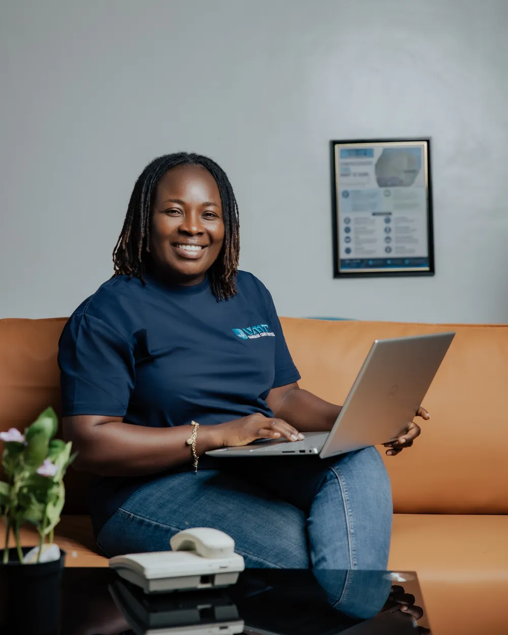 Smiling VMT care coordinator at a laptop